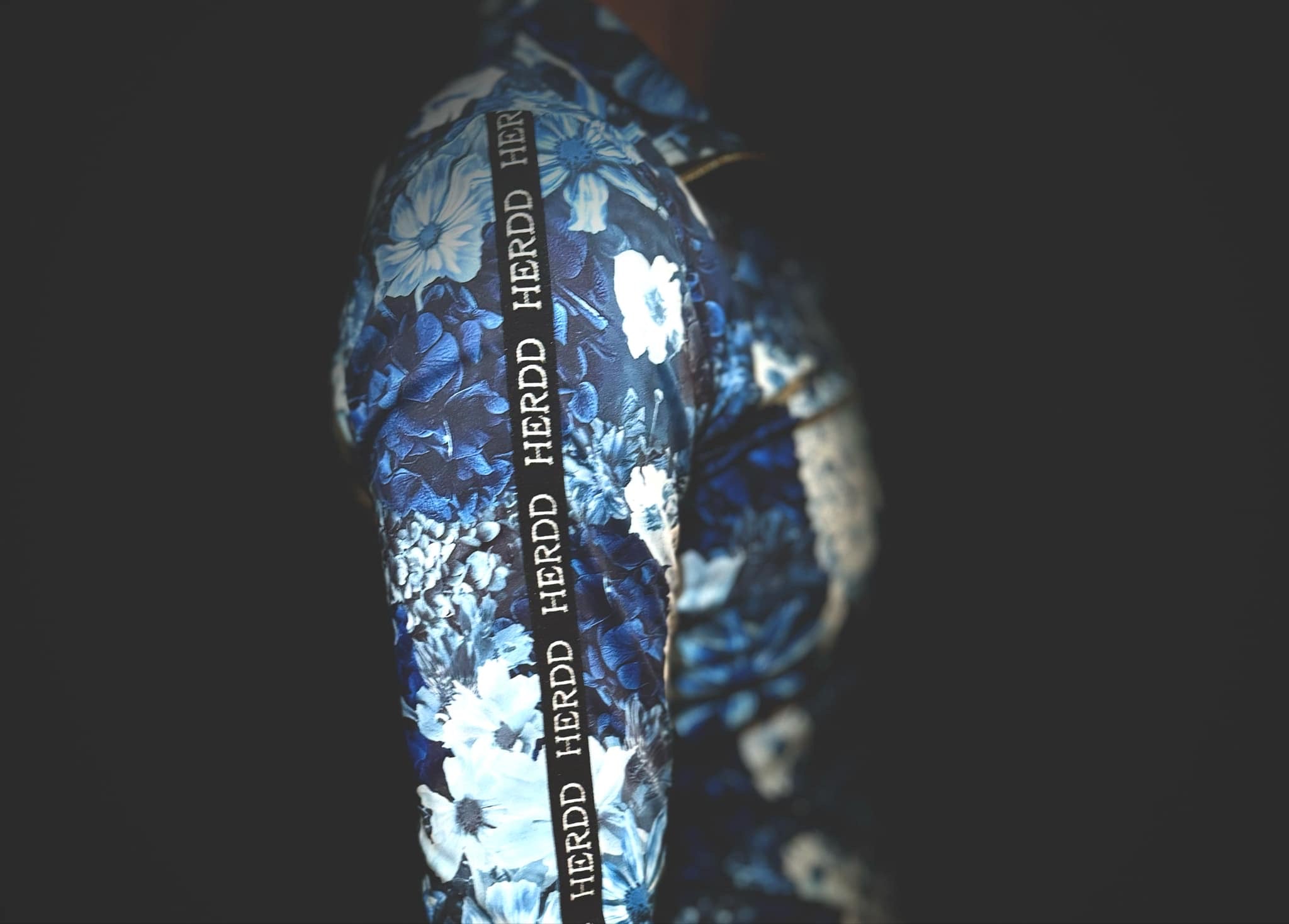The HERDD Merch blue -out FLORAL base layer